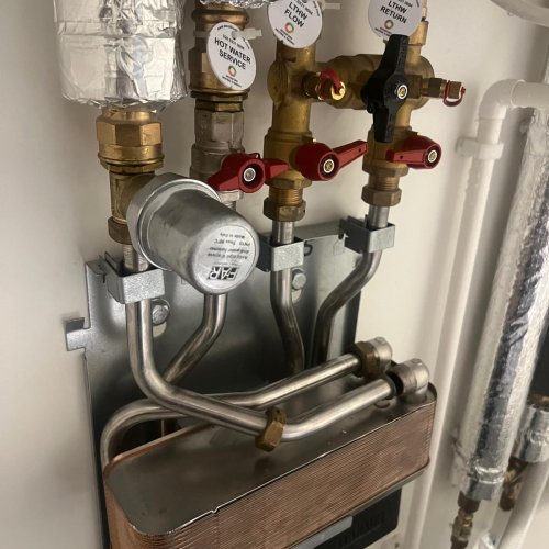 Labelled heating manifold with isolation valves and pump